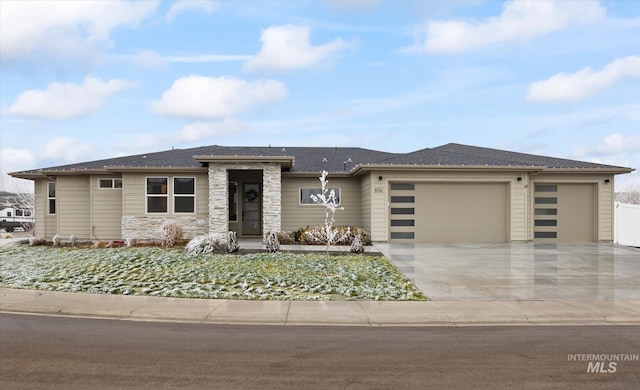 prairie-style home featuring a garage