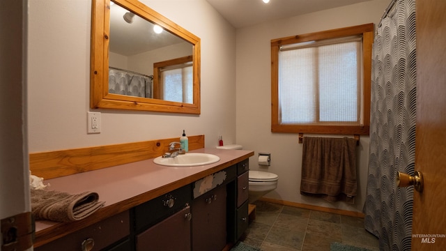 full bathroom featuring toilet and vanity