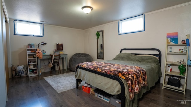 bedroom featuring wood finished floors