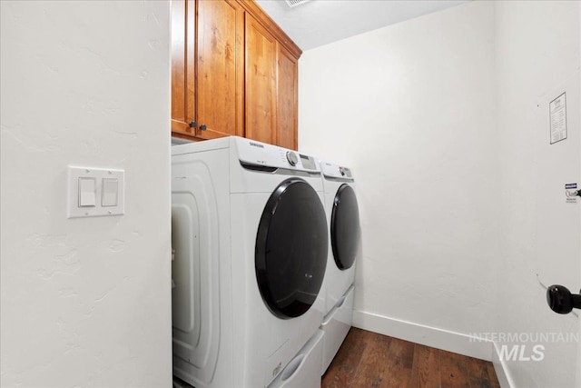 1041 White Horse Ridge Dr, Middleton, ID 83644 - washroom featuring separate washer and dryer, cabinet space, baseboards, and dark wood-style floors