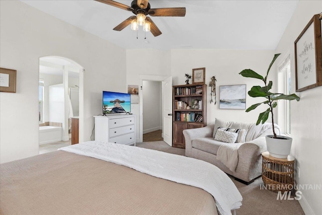 1041 White Horse Ridge Dr, Middleton, ID 83644 - carpeted bedroom with arched walkways, connected bathroom, baseboards, and ceiling fan