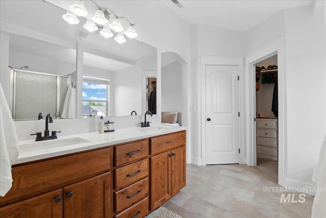 1041 White Horse Ridge Dr, Middleton, ID 83644 - full bath with a stall shower, a walk in closet, and double vanity