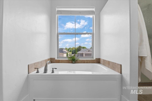 1041 White Horse Ridge Dr, Middleton, ID 83644 - full bathroom featuring a garden tub and plenty of natural light