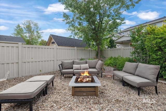 1041 White Horse Ridge Dr, Middleton, ID 83644 - fenced backyard featuring an outdoor living space with a fire pit