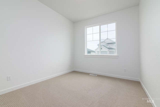 spare room featuring carpet