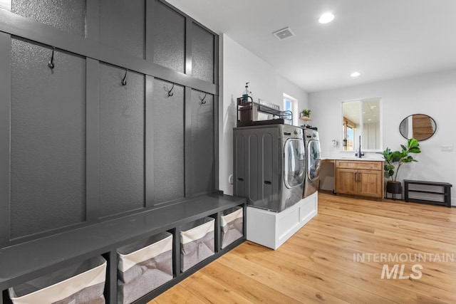 5251 Hidden Hollow Ln, Emmett, ID 83617 - laundry room with washer and dryer, light wood-type flooring, and recessed lighting