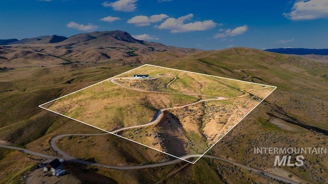 5251 Hidden Hollow Ln, Emmett, ID 83617 - aerial overview of property's location with property boundaries highlighted and a mountain backdrop