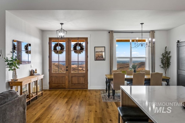5251 Hidden Hollow Ln, Emmett, ID 83617 - entrance foyer with a chandelier and wood-type flooring