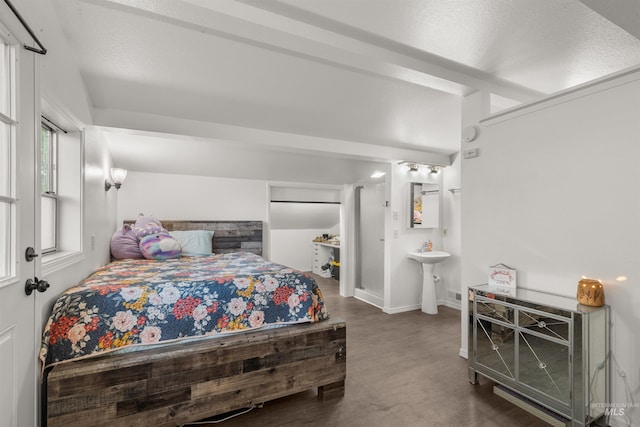 bedroom featuring wood-type flooring and sink