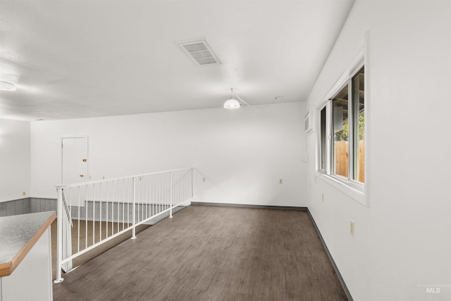 spare room featuring dark hardwood / wood-style flooring