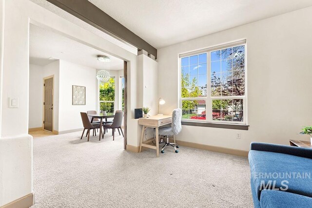 home office featuring baseboards and carpet