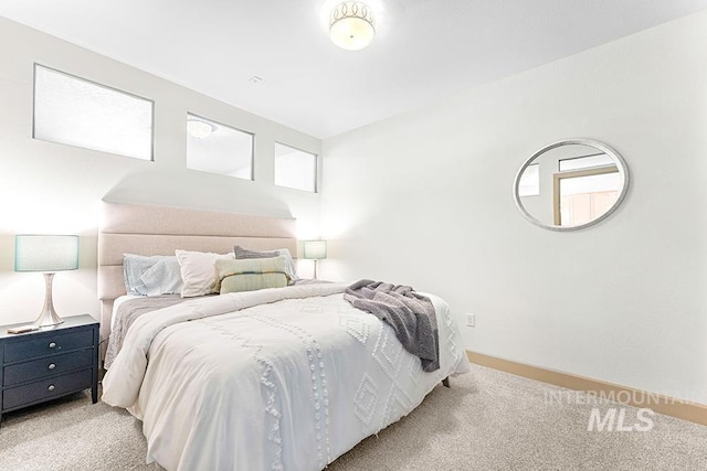 bedroom featuring light colored carpet