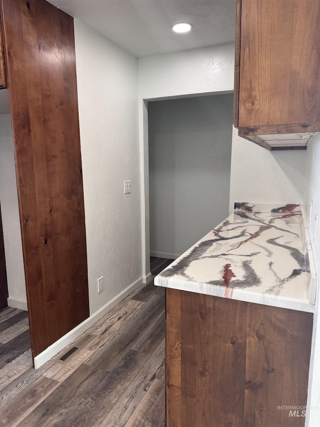 kitchen featuring visible vents, baseboards, dark wood-style flooring, light countertops, and recessed lighting