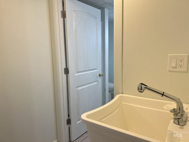 bathroom with a bathtub, a sink, and toilet