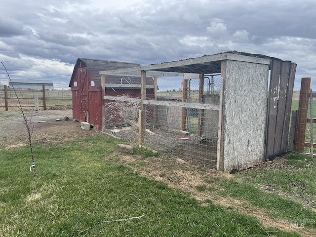 view of poultry coop with fence and a lawn