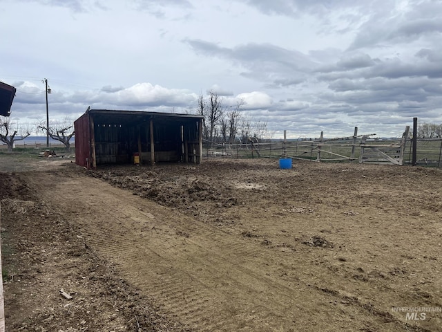 view of pole building with fence