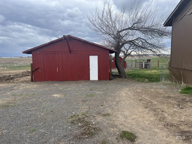 view of pole building with fence