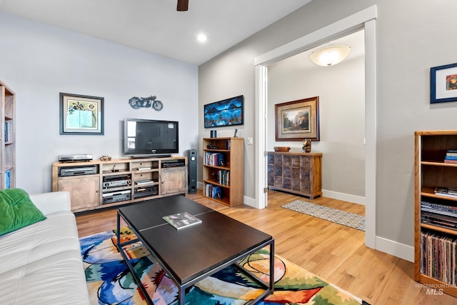 living room with recessed lighting, light wood-style flooring, a ceiling fan, and baseboards