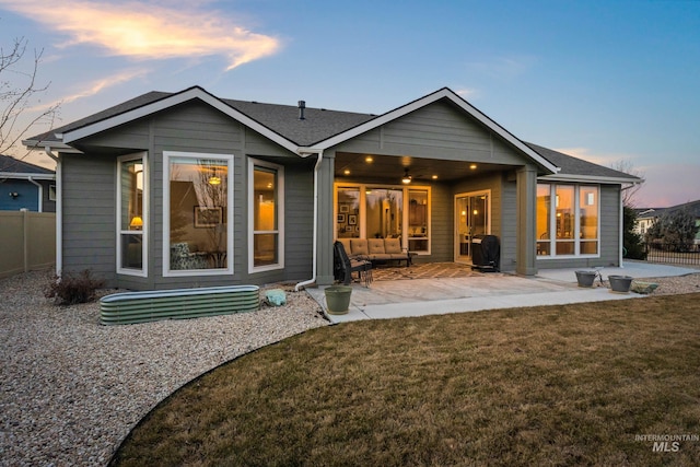 back of house with a patio area, a yard, and fence