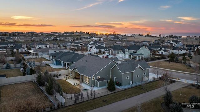 aerial view at dusk with a residential view