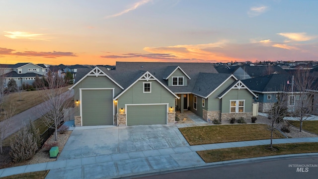 craftsman inspired home featuring a front lawn, stone siding, a residential view, roof with shingles, and concrete driveway