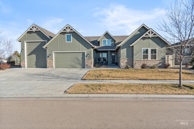 craftsman-style home with driveway