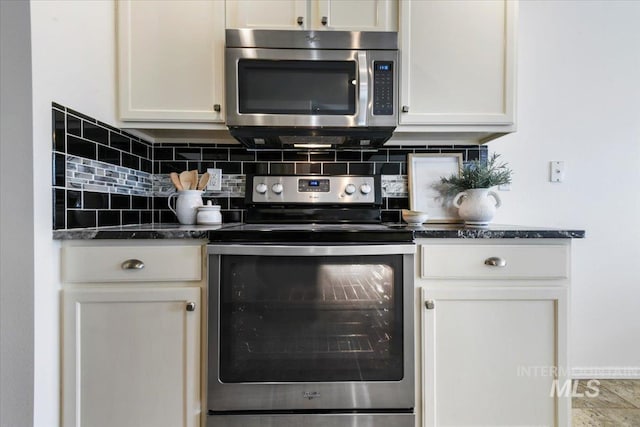 kitchen featuring white cabinetry, backsplash, and stainless steel appliances