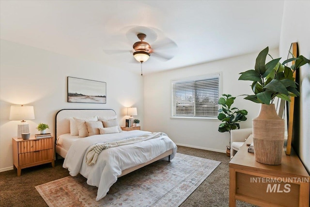 bedroom with baseboards, carpet floors, and a ceiling fan