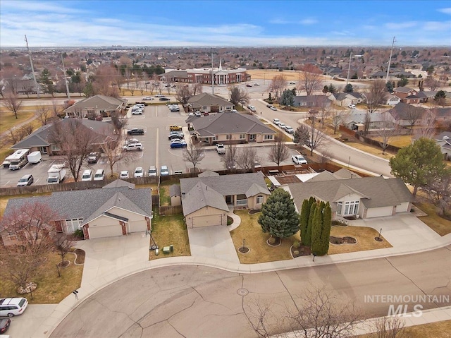 birds eye view of property with a residential view