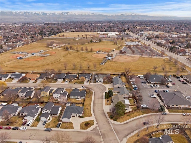 aerial view featuring a mountain view and a residential view