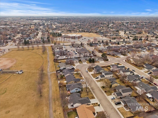 birds eye view of property with a residential view