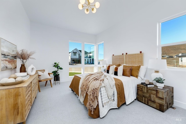 bedroom featuring carpet floors, a notable chandelier, and baseboards