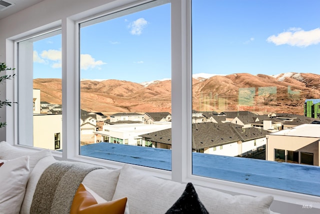 entryway featuring visible vents, a residential view, and a mountain view