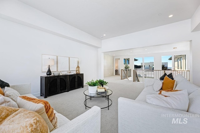 carpeted living area featuring recessed lighting