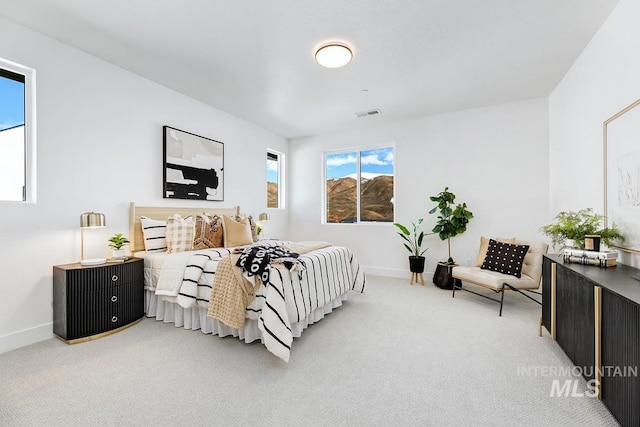 bedroom featuring visible vents, baseboards, and carpet flooring