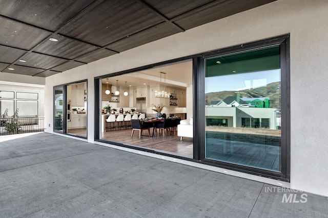 property entrance featuring stucco siding