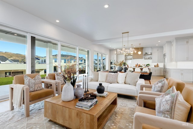 living room with a chandelier and recessed lighting