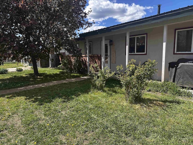 104 Friendship Ln, Council, ID 83612 - view of home's exterior featuring a yard and stucco siding