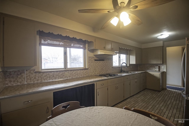 104 Friendship Ln, Council, ID 83612 - kitchen with cooktop, backsplash, ceiling fan, and light countertops
