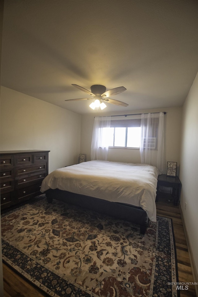 104 Friendship Ln, Council, ID 83612 - bedroom featuring wood finished floors and ceiling fan