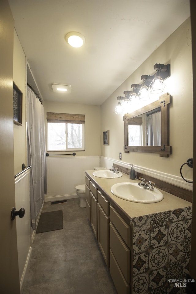 104 Friendship Ln, Council, ID 83612 - full bathroom featuring double vanity and a shower with shower curtain