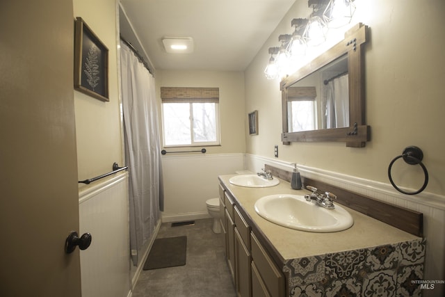 104 Friendship Ln, Council, ID 83612 - full bath featuring double vanity and wainscoting