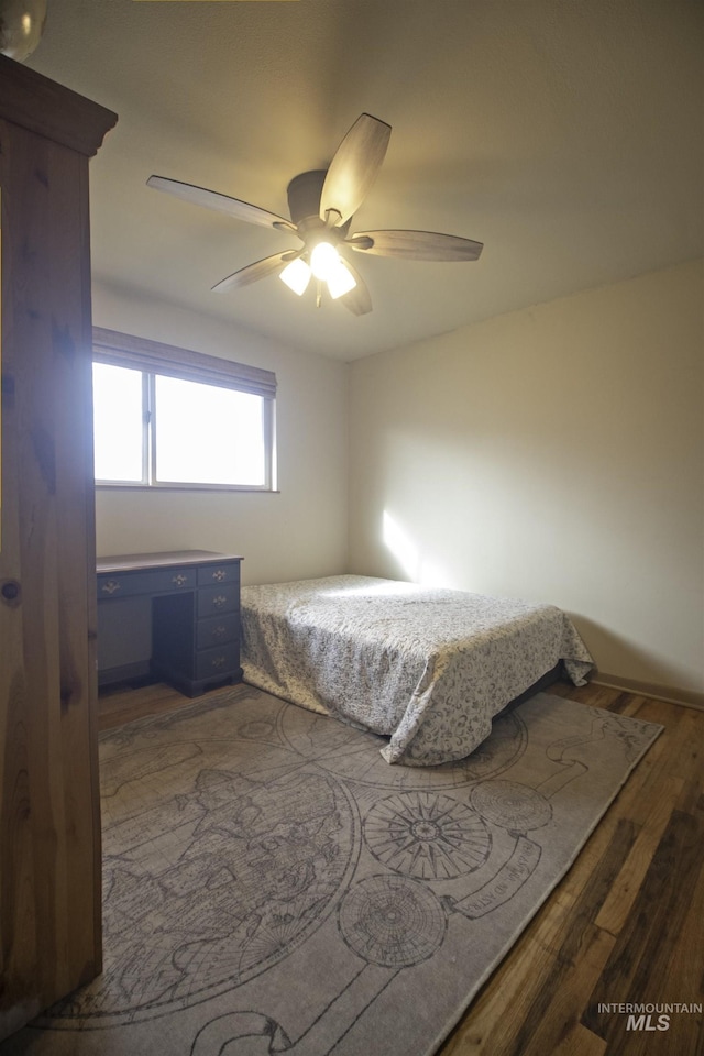 104 Friendship Ln, Council, ID 83612 - bedroom with wood finished floors and ceiling fan
