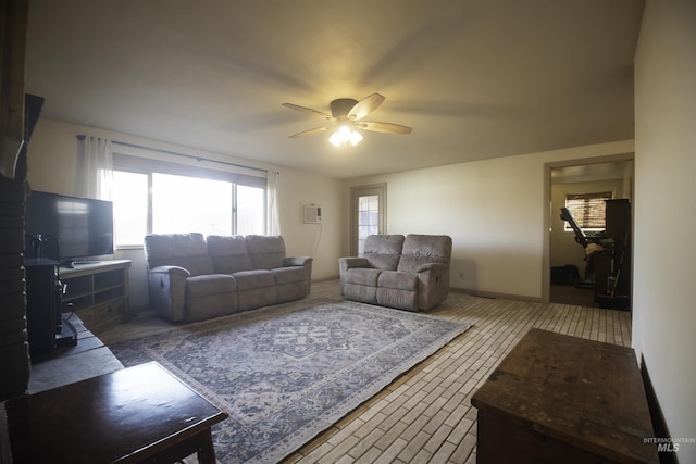 104 Friendship Ln, Council, ID 83612 - living area with a ceiling fan and healthy amount of natural light