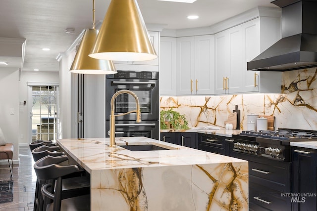 1915 S Roosevelt St, Boise, ID 83705 - kitchen with wall chimney exhaust hood, gas stovetop, light stone counters, white cabinets, and backsplash