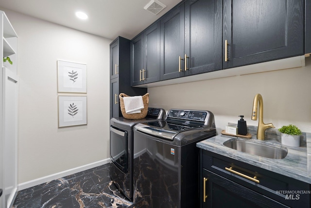 1915 S Roosevelt St, Boise, ID 83705 - laundry area with dark marble finish flooring, washing machine and dryer, baseboards, cabinet space, and recessed lighting