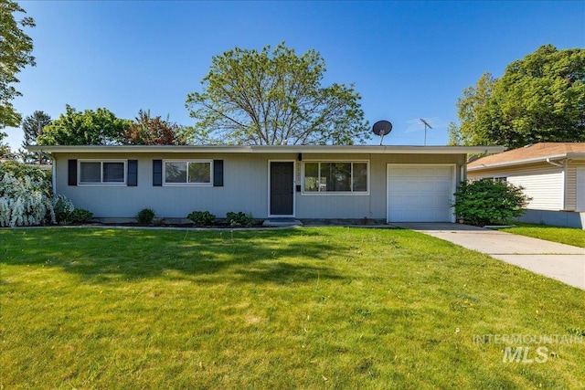 ranch-style home with a garage and a front yard