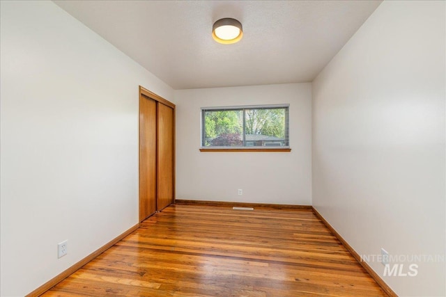 empty room featuring hardwood / wood-style floors