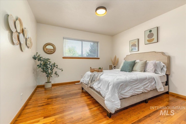 bedroom featuring wood-type flooring