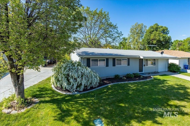 view of front of home with a garage and a front yard